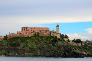 Fototapeta na wymiar View of the Faro di Forte Stella lighthouse on Portoferraio, on Elba Island, Livorno, Italy