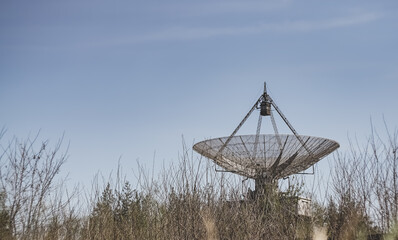 The metal structure of the astronomical radio telescope observatory on the territory of the...