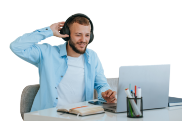 Handsome beardy caucasian young man sitting at desk against transparent background with laptop makes video call uses headphones. Cheerful American business man remote works home.