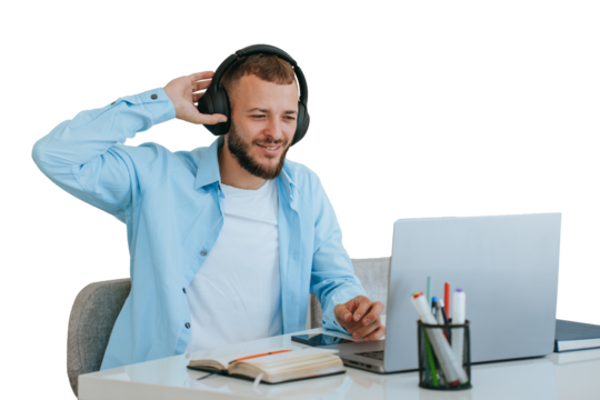 Handsome beardy caucasian young man sitting at desk against transparent background with laptop makes video call uses headphones. Cheerful American business man remote works home. - Powered by Adobe