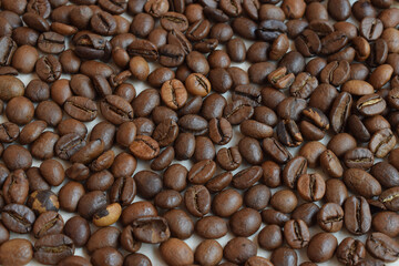 Roasted coffee beans, background with coffee beans