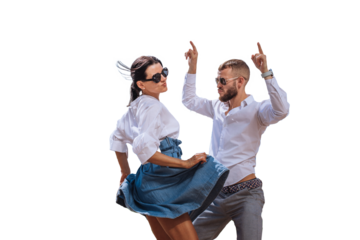 Young couple in casual clothes, sunglasses dancing against transparent background. Beard caucasian man enjoying journey with girlfriend. Leisure, music, active people. Party time, discoteque.