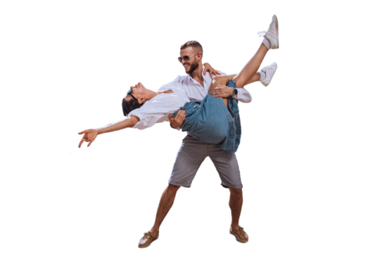 Happy caucasian couple in casual clothes sunglasses dancing against transparent background. Bearded young man lifting up girlfriend smiles. Travel, summertime leisure. Freedom concept, happiness. - Powered by Adobe