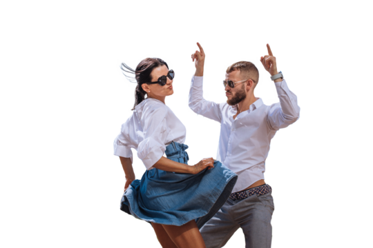 Young couple in casual clothes, sunglasses dancing against transparent background. Beard caucasian man enjoying journey with girlfriend. Leisure, music, active people. Party time, discoteque. - Powered by Adobe