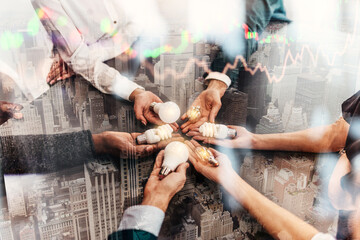 Teamwork and brainstorming concept with businessmen that share an idea with a lamp