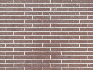 Obraz premium The pattern of brown brick. Building material for a country house. Modern construction methods in civil engineering.