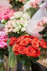 Obraz na płótnie Canvas Flower shop concept. Different varieties fresh spring flowers in refrigerator room for flowers. Bouquets on shelf, florist business