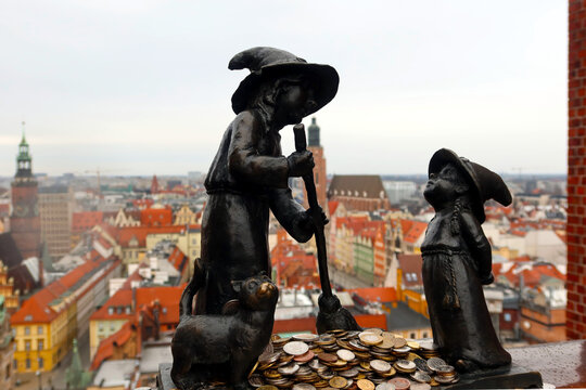 Wroclaw Dwarfs. Tekla and Martynka witches (in Polish: Czarownice Tekla i Martynka) on the observation deck of St. Mary Magdalene's Church in Wroclaw city. Wroclaw, Poland - February 20, 2023