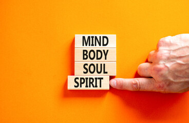 Mind body soul spirit symbol. Concept words Mind Body Soul Spirit on wooden blocks. Beautiful...
