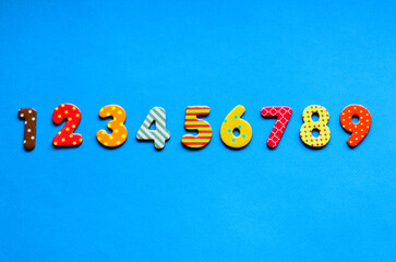 numbers from one to nine  one on blue paper background