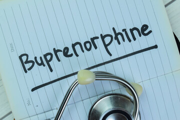 Concept of Buprenorphine write on book with stethoscope isolated on Wooden Table.