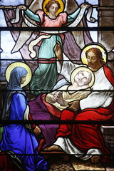 Obraz premium Stained glass in Saint-Aubin church, Houlgate. Jesus curing the sick. France.