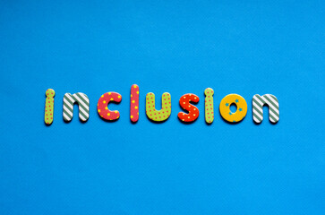 word inclusion on blue paper background