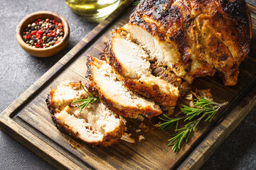 Roasted pork, glazed ham on serving board. Homemade recipe.