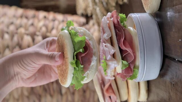 tigelle or crescentine homemade, con prosciutto, salame, stracciatella liquida. Italian food typical of the area of Modena, Emilia-Romagna. Thin round breads stuffed with prosciutto. 4k footage