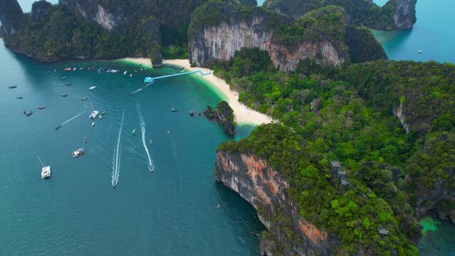 Hong Island is a stunning island located in the Krabi Province of Thailand. a popular destination for tourists seeking a secluded and serene island experience. Travel and nature concept. 4K Drone 
