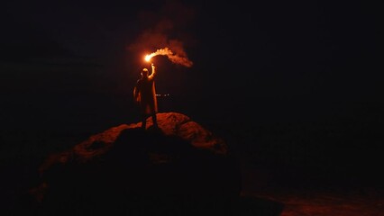 lonely person or fisherman disaster victim signal light at night help signal ocean at night