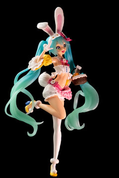Russia, St. Petersburg, February 2023: Bunny, Easter bunny Hatsune Miku figurine with a basket on a black background
