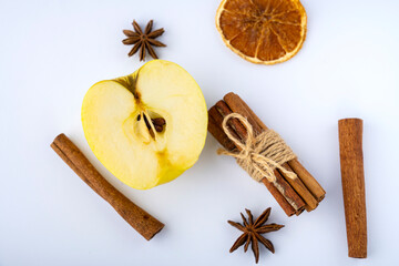 apple with cinnamon and anise on a white background