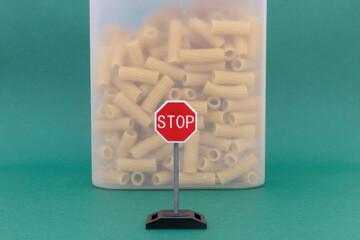 Carbohydrate increase concept - pasta and road sign