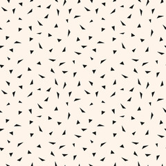 Vector minimalist geometric texture with small chaotic triangles, tiny shapes. Abstract modern seamless pattern. Simple minimal monochrome background. Black and white repeat decorative geo design
