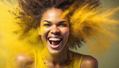 african american woman portrait in yellow color powder exploding splashes on black background. Fun happy excited.