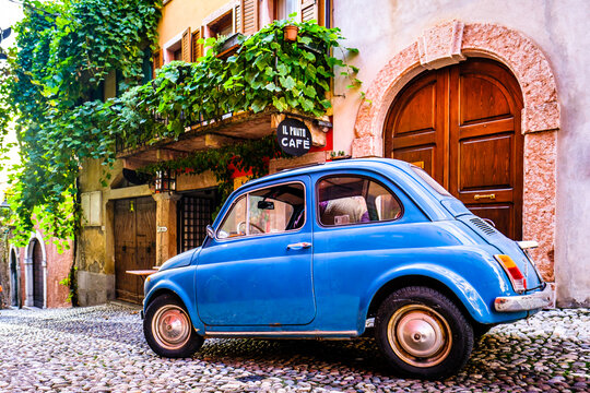 Malcesine, Italy - November 10: vintage car Fiat 500 at the old town of Malcesine on November 10, 2022