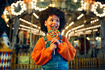 Kids having fun on a carnival Carousel