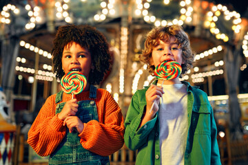 Kids having fun on a carnival Carousel