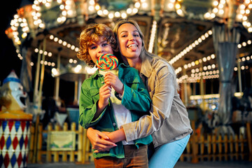 Kids having fun on a carnival Carousel