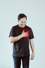Photo of person clutching chest in pain. Concept of diseases, cardiac arrest, heart pain, health.