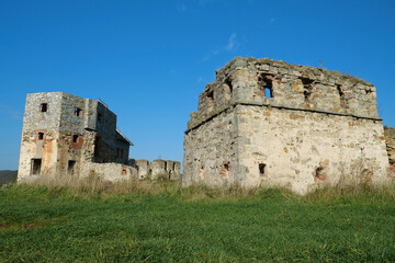 Fototapeta na wymiar Ancient stone towers in Pniv Castle - medieval historical object, Ukraine