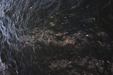 Italian landscape that reflects the dolce vita m summer. after sunset, with palm trees and sea and lake.