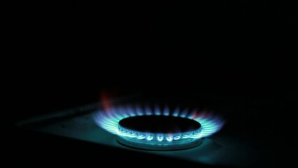 ignition of a gas burner from a match at night in complete darkness