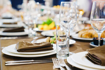 a festive served table with snacks and tableware.