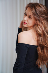 Fototapeta premium portrait of a beautiful sexual woman in a black bodysuit