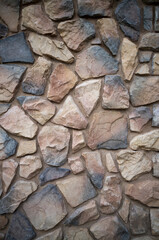 Profile View of a Tan, White, and Gray Stone Wall.