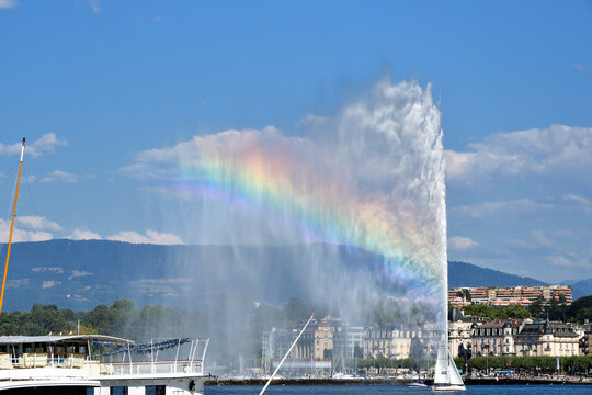 Switzerland, Geneva. A rainbow over the Jet d'Eau (Water-Jet) on Lake Geneva. August 16, 2022.