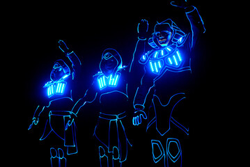 dance team in costumes of the LEDs