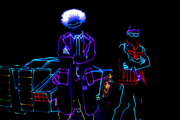 dance team in costumes of the LEDs . Laser dance show