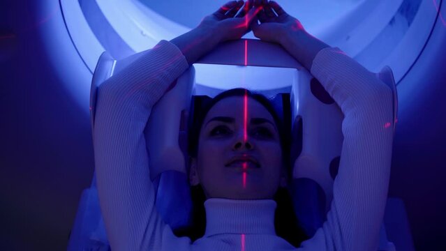 4k video CT scan of abdomen of woman close-up in medical clinic. Girl patient is doing computed tomography x-ray examination of abdominal in a CT scan room top view.