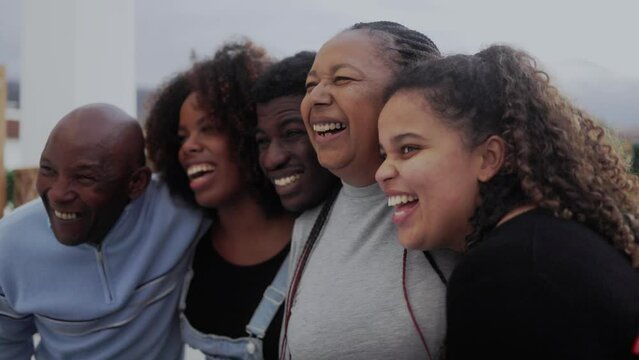 Happy african family having fun together outdoor - Diverse lifestyle community concept