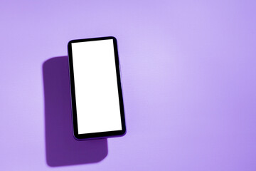 Smartphone with white screen on top of purple table. Purple concept. White screen concept. png