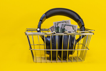 headphones shopping cart , for listening to music, black color plastic, metal grille, stand on the...