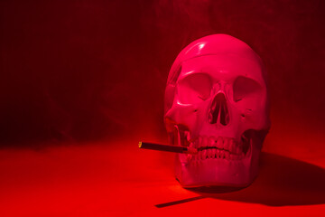 skull of a man with a cigarette bone skeleton,one object,sinister terrible horror, red in color,with a burning cigarette in the smoke. concept death from nicotine smoking