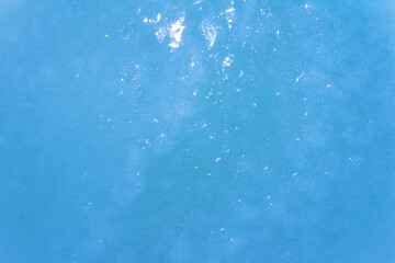 Close up photo texture of highlighted and frozen water surface.