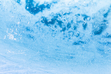 Close up photo texture of highlighted and frozen water surface.