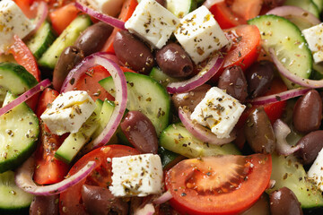 Greek salad with fresh vegetables, feta cheese, kalamata olives, dried oregano, red wine vinegar and olive oil. Healthy food.