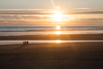 Beach in orange sunlight just before sunset