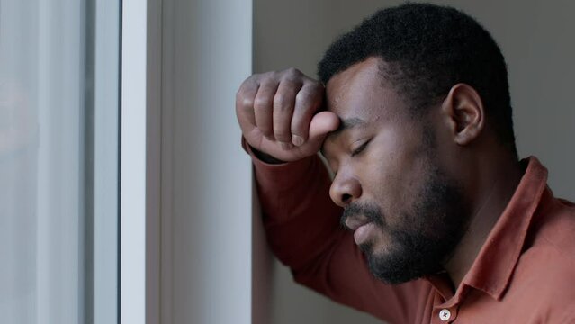 Seasonal apathy. Young depressed african american guy thinking about his life, suffering from stress, free space